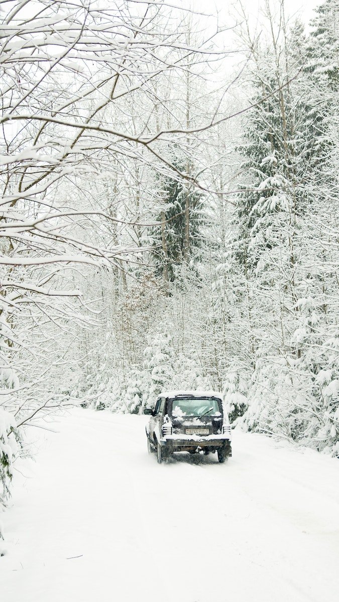 Black Suv on Snow Covered Road